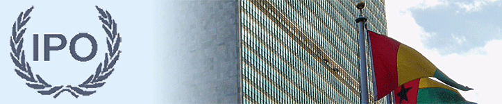 A tall building reaches towards the sky, showcasing its impressive height and modern architectural design